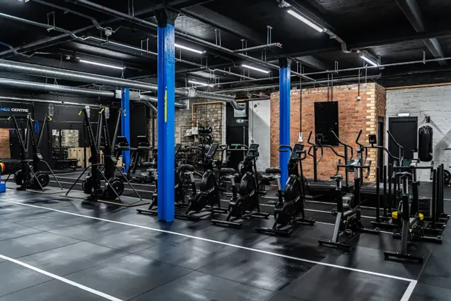 Training zone with brick feature wall and TV